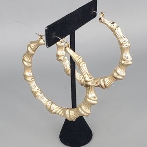 Large Goldtone Bamboo Hollow Hoop Earrings